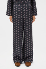 Profile view of model wearing the Oroton FOULARD PRINT PJ PANT in North Sea and 100% silk twill fabric for Women