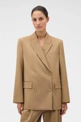 Profile view of model wearing the Oroton Db Blazer in Hazelnut and 97% wool and 3% spandex blend fabric for Women . IP:3