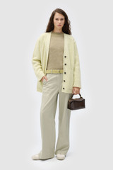 Profile view of model wearing the Oroton Oversized Manstyle Cardigan in Sorbet and 80% wool and 20% nylon fabric for Women . IP:3