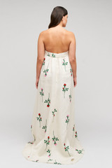 Profile view of model wearing the Oroton Rosebud Gown in Antique White and 100% linen material for Women .