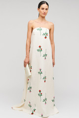 Profile view of model wearing the Oroton Rosebud Gown in Antique White and 100% linen material for Women .