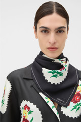 Profile view of model wearing the Oroton Folk Doilie Silk Scarf in Black and 100% silk twill fabric for Women . IP:2