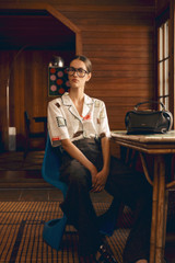 Profile view of model wearing the Oroton LABEL PRINT CAMP SHIRT in Cream and 100% silk twill fabric for Women .