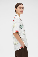 Profile view of model wearing the Oroton Label Print Camp Shirt in Cream and 100% silk twill fabric for Women . IP:3