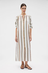 Profile view of model wearing the Oroton Fiesta Stripe Column Dress in Multi and 100%  linen fabric for Women .