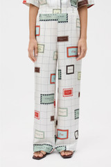 Profile view of model wearing the Oroton Label Print Pyjama Pant in Cream and 100% silk fabric for Women . IP:3