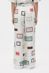 Profile view of model wearing the Oroton Label Print Pyjama Pant in Cream and 100% silk fabric for Women .