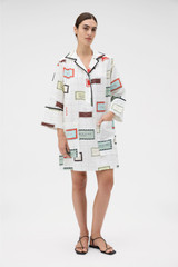 Profile view of model wearing the Oroton Vintage Label Print Tunic Dress in Cream and 100%  linen fabric for Women . IP:3