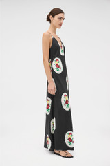 Profile view of model wearing the Oroton Folk Doilie Print Slip Dress in Black and 100% silk fabric for Women . IP:4