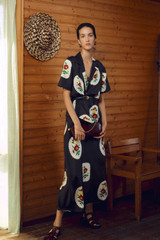 Profile view of model wearing the Oroton Folk Doilie Print Slip Dress in Black and 100% silk fabric for Women . IP:7
