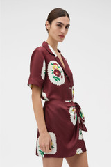 Profile view of model wearing the Oroton Folk Doilie Sarong Skirt in Burgundy and 100% silk fabric for Women . IP:3