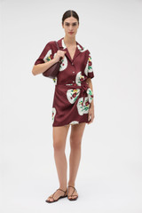 Profile view of model wearing the Oroton Folk Doilie Sarong Skirt in Burgundy and 100% silk fabric for Women . IP:2