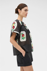 Profile view of model wearing the Oroton Folk Doilie Print Top in Black and 100% cotton fabric for Women . IP:4