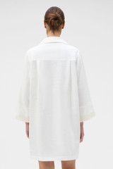 Profile view of model wearing the Oroton Embroidered Tunic Dress in Antique White and 100%  linen fabric for Women . IP:4