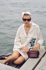Profile view of model wearing the Oroton Embroidered Tunic Dress in Antique White and 100%  linen fabric for Women . IP:6