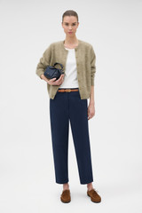Profile view of model wearing the Oroton Arlo Carpenter Chino in NORTH SEA and 100% cotton fabric for Women . IP:7