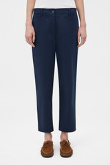 Profile view of model wearing the Oroton Arlo Carpenter Chino in NORTH SEA and 100% cotton fabric for Women . IP:2