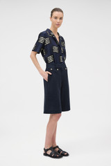 Profile view of model wearing the Oroton Button Detail Culotte in NORTH SEA and 100% bonded heavy linen fabric for Women . IP:4