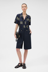 Profile view of model wearing the Oroton Button Detail Culotte in NORTH SEA and 100% bonded heavy linen fabric for Women . IP:6