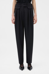 Profile view of model wearing the Oroton High Waist Pleat Pant in BLACK and 53% polyester, 43% wool, and 4% lycra Italian wool blend for Women . IP:2