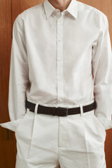 Profile view of model wearing the Oroton Jessie Woven Belt in CHOCOLATE and Premium woven bonded leather for Men . IP:8