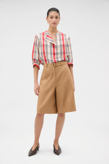 Profile view of model wearing the Oroton Belt Detail Culotte in CAMEL and 100% heavyweight linen fabric for Women . IP:2