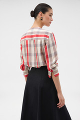 Profile view of model wearing the Oroton Shadow Check Long Sleeve Shirt in MARKET RED and 100% silk dupion fabric for Women . IP:6