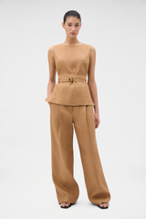 Profile view of model wearing the Oroton Belted Shell in CAMEL and 100% heavyweight linen fabric for Women .