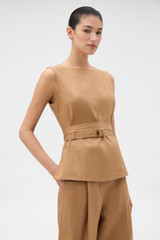 Profile view of model wearing the Oroton Belted Shell in CAMEL and 100% heavyweight linen fabric for Women .