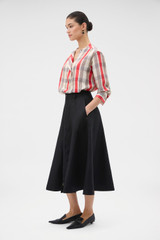 Profile view of model wearing the Oroton Zip Midi Skirt in BLACK and 100% heavyweight linen fabric for Women . IP:3