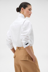 Profile view of model wearing the Oroton Tie Neck Shirt in WHITE and 100% cotton poplin fabric for Women . IP:4