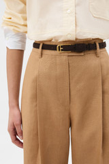 Profile view of model wearing the Oroton CALI 19MM BELT SUEDE in DARK CHOCOLATE and  for Women . IP:2