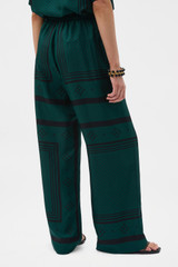 Profile view of model wearing the Oroton SPOT SCARF PRINT TROUSER in HELM GREEN and 100% silk twill fabric for Women . IP:5