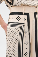 Profile view of model wearing the Oroton Spot Scarf Print Culotte in NOUGAT and 100% silk twill fabric for Women . IP:3