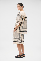 Profile view of model wearing the Oroton Spot Scarf Print Blouse in NOUGAT and 100% silk twill fabric for Women . IP:5