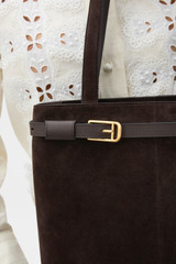 Profile view of model wearing the Oroton Cali Tote Suede in Dark Chocolate and Premium suede leather for Women .