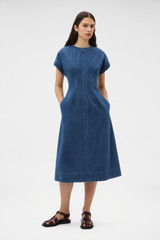 Profile view of model wearing the Oroton Denim Dress in Denim and 100% cotton fabric for Women . IP:2