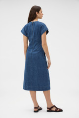 Profile view of model wearing the Oroton Denim Dress in Denim and 100% cotton fabric for Women . IP:4