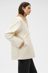 Profile view of model wearing the Oroton Cotton Chore Jacket in Calico and 100% cotton fabric for Women . IP:3