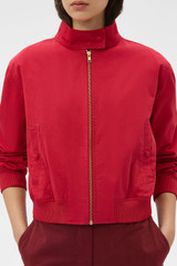 Profile view of model wearing the Oroton Knit Trim Bomber in Cerise and 100% cotton fabric for Women . IP:4
