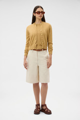 Profile view of model wearing the Oroton Cotton Knit Cardigan in Cashew and 100% cotton fabric for Women . IP:6