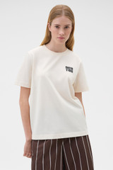 Profile view of model wearing the Oroton Maggie Graphic Tee in Calico and 100% cotton single jersey fabric for Women . IP:2