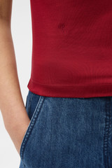 Profile view of model wearing the Oroton Fine Rib Tee in Rouge and 100% Pima cotton fabric for Women . IP:4