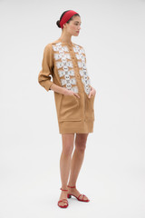 Profile view of model wearing the Oroton Broderie Trim Dress in CAMEL and 100% heavyweight linen fabric for Women .