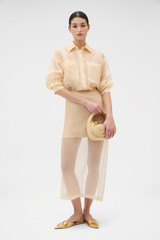 Profile view of model wearing the Oroton Organdy Overshirt in Nougat and 100% sheer silk organza fabric for Women . IP:6