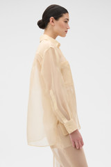 Profile view of model wearing the Oroton Organdy Overshirt in Nougat and 100% sheer silk organza fabric for Women . IP:3