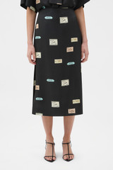 Profile view of model wearing the Oroton Vintage Label Skirt in Black and 100% silk twill fabric for Women .