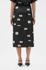 Profile view of model wearing the Oroton Vintage Label Skirt in Black and 100% silk twill fabric for Women .