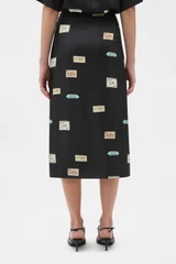 Profile view of model wearing the Oroton Vintage Label Skirt in Black and 100% silk twill fabric for Women . IP:5