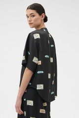 Profile view of model wearing the Oroton Vintage Label Blouse in Black and 100% silk twill fabric for Women . IP:3